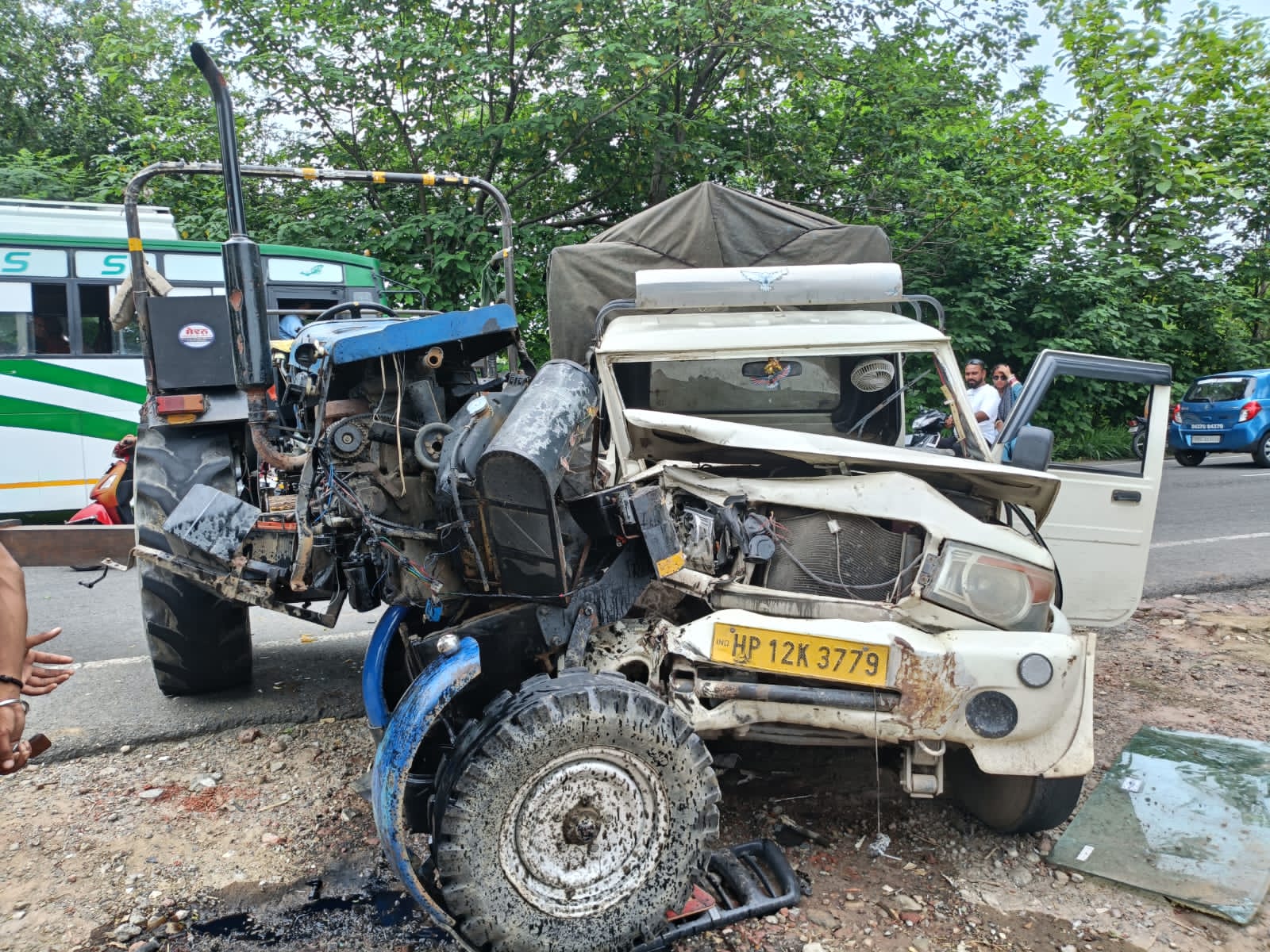 Tractor and Mahindra vehicle collided head-on, drivers escaped unhurt.